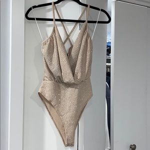Gold sparkle body suit